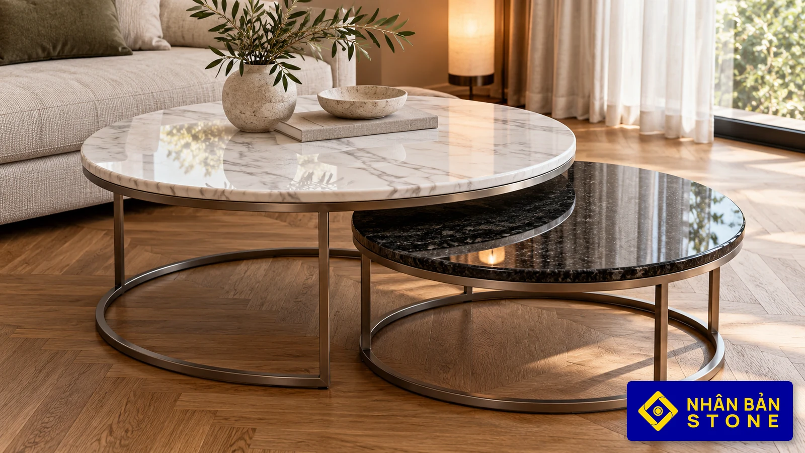 Illustrative image: Nested round coffee tables with white marble and black granite tops in a contemporary living room – NHAN BAN STONE