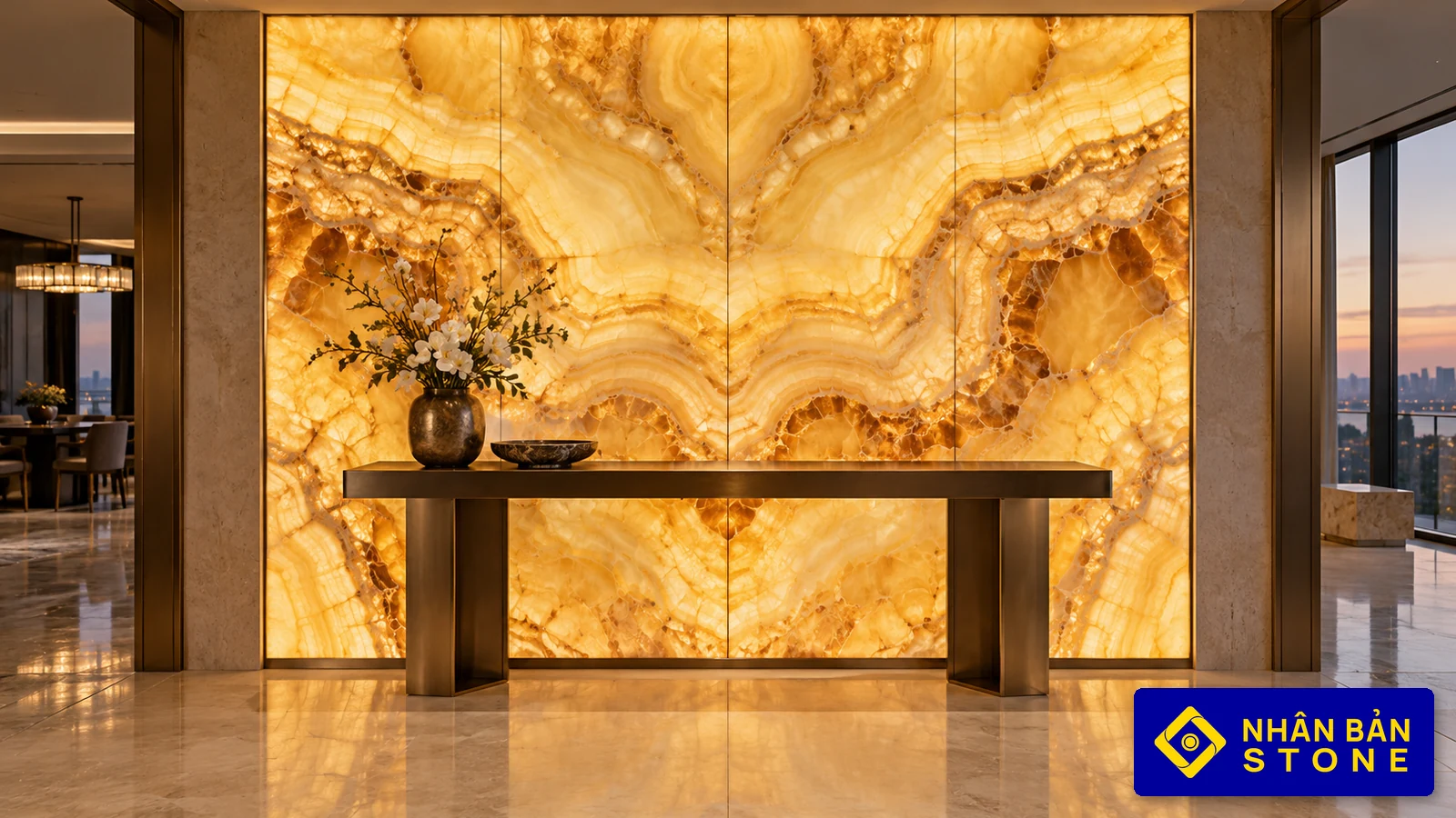 Illustrative image: Backlit bookmatched honey-amber onyx wall panel in luxury penthouse foyer – NHAN BAN STONE